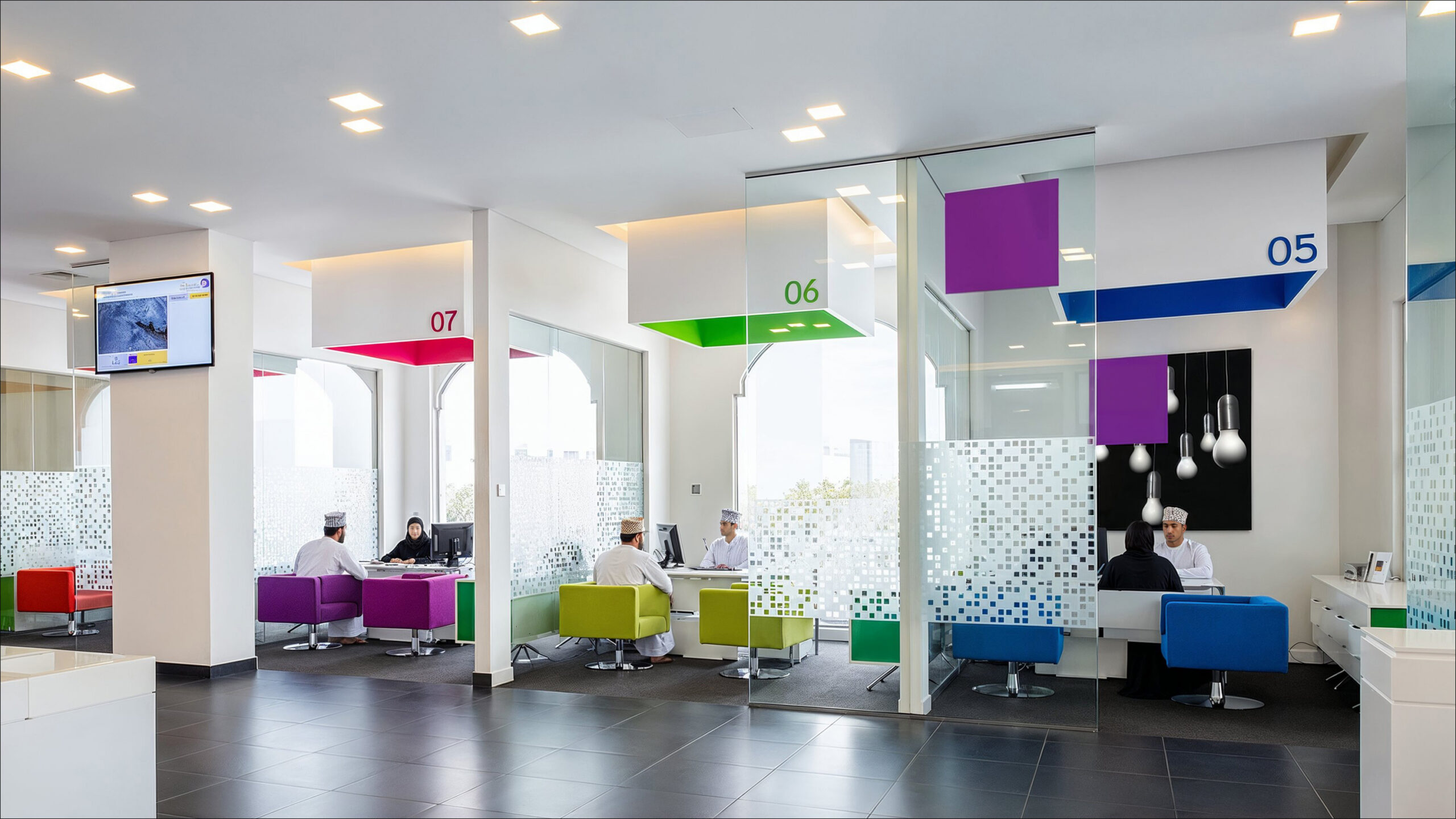 Open Bank Nizwa banking hall with colour coded customer counters