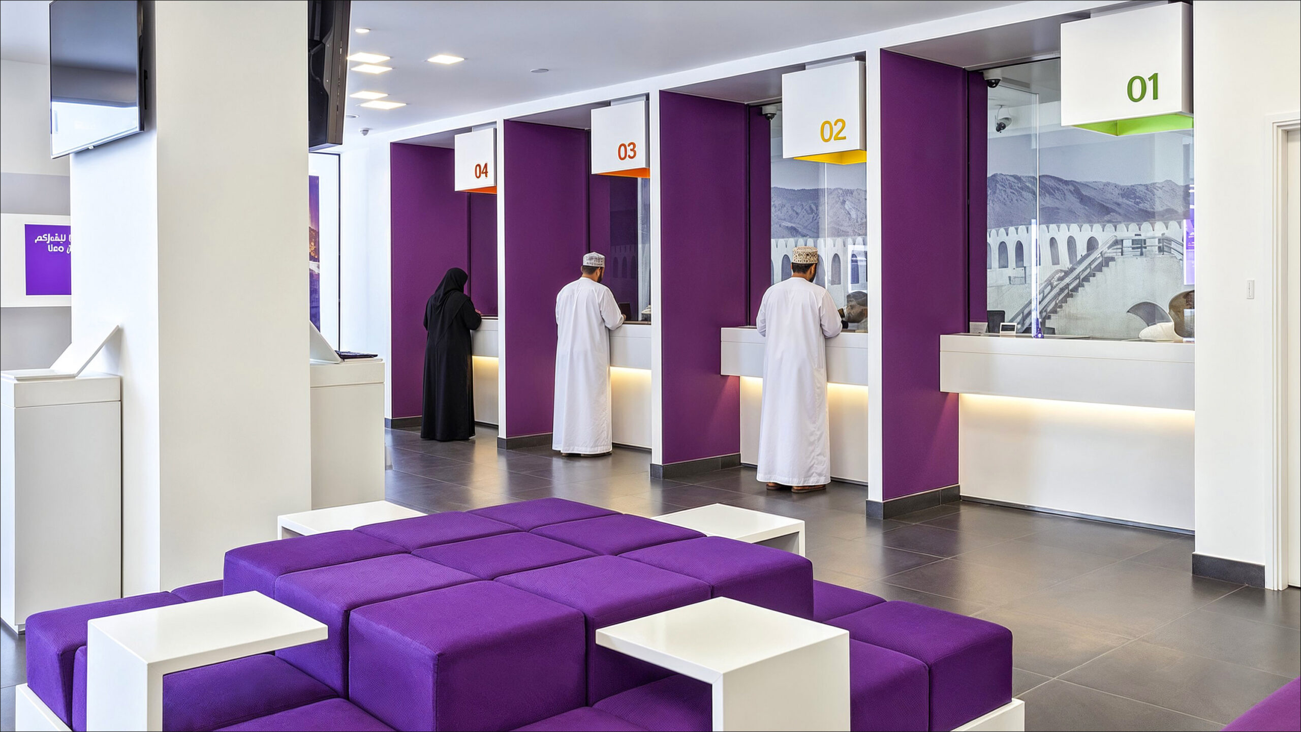 Bank Nizwa branch courtyard with purple seating and service counters