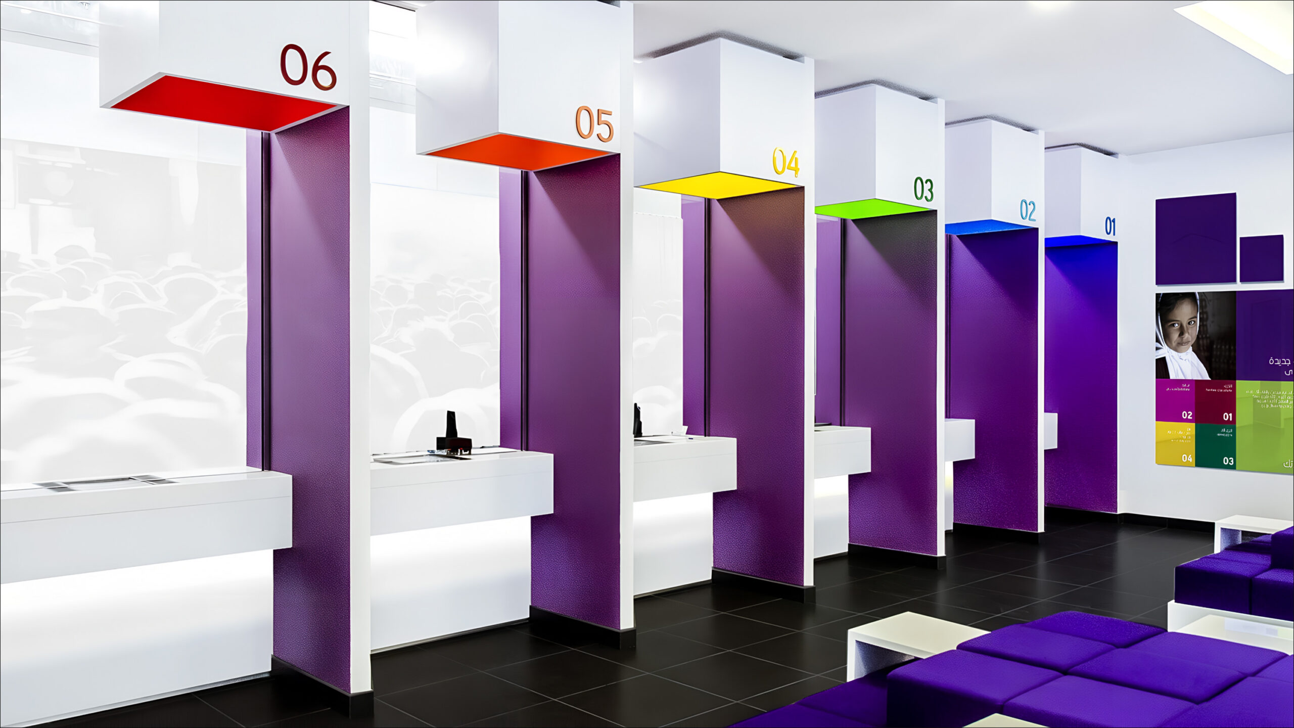 Colourful numbered service counters in a Bank Nizwa branch