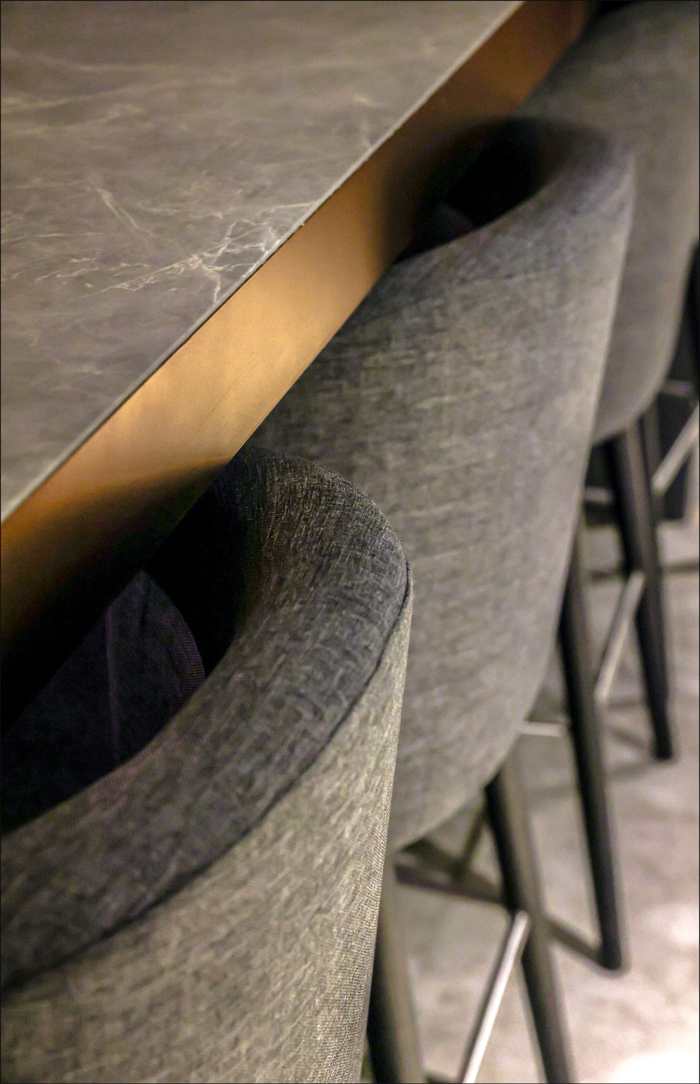 Upholstered seating and stone table detail