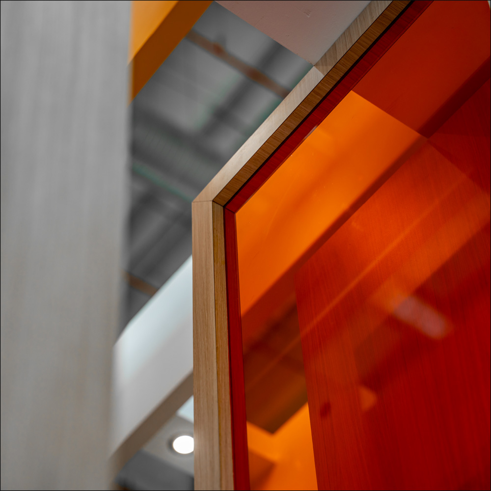 Orange glazing and timber frame detail at PwC LEAP 2026