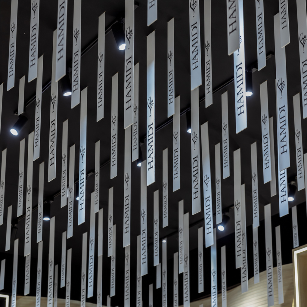 Suspended fragrance strips above the Hamidi stand