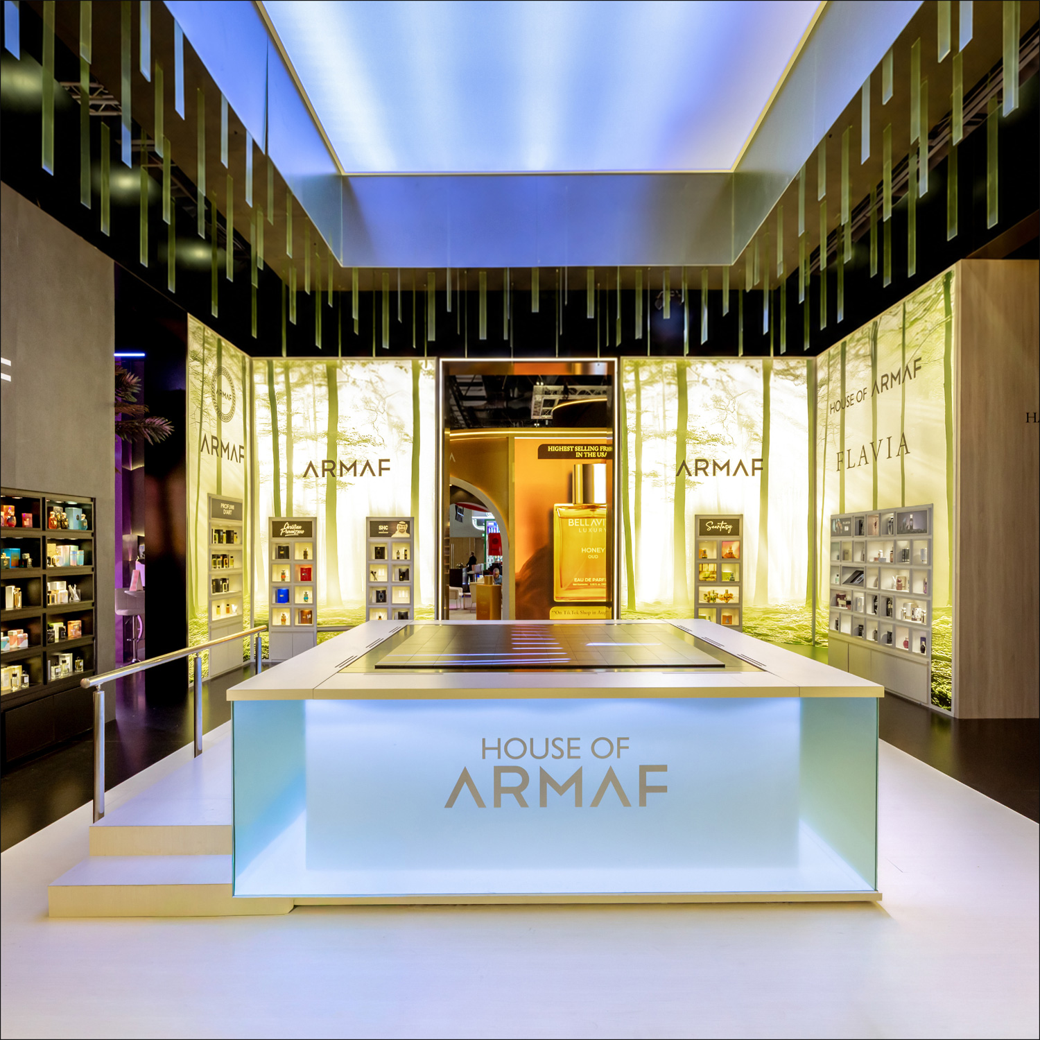 House of ARMAF product display beneath a luminous ceiling