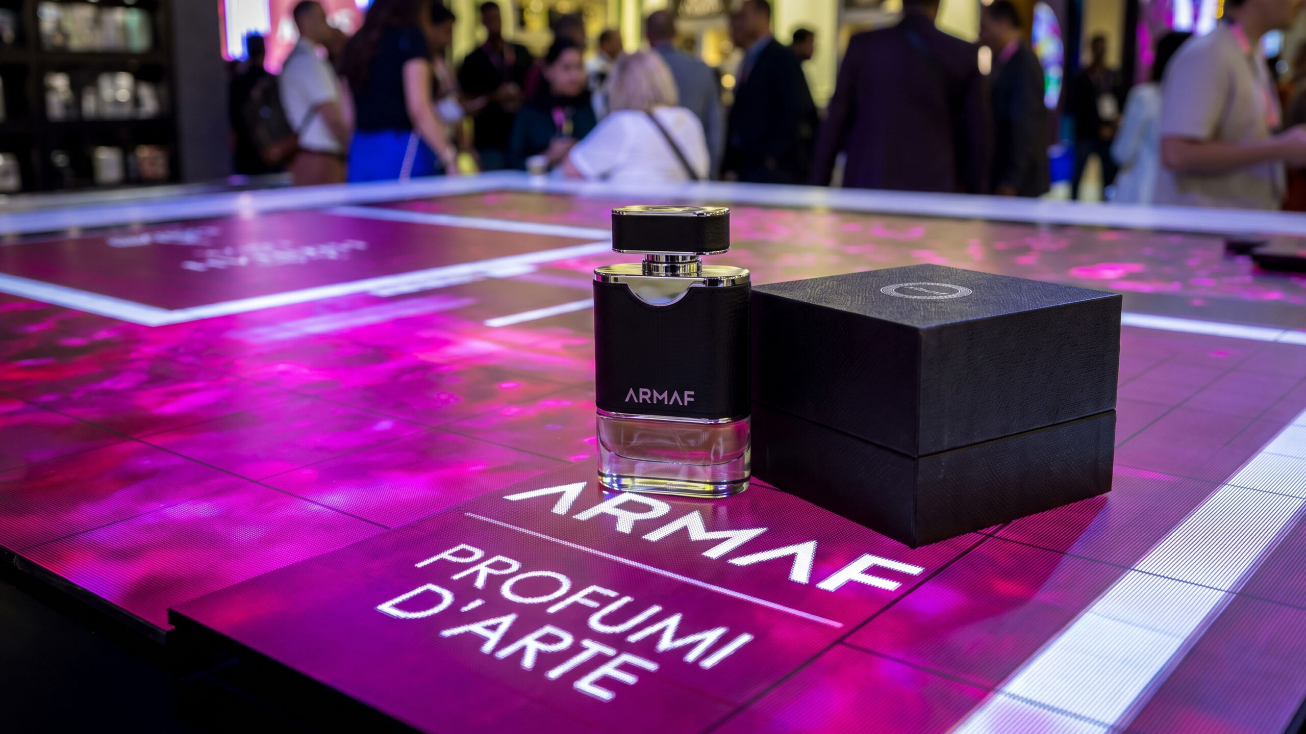 ARMAF fragrance presented on an illuminated table