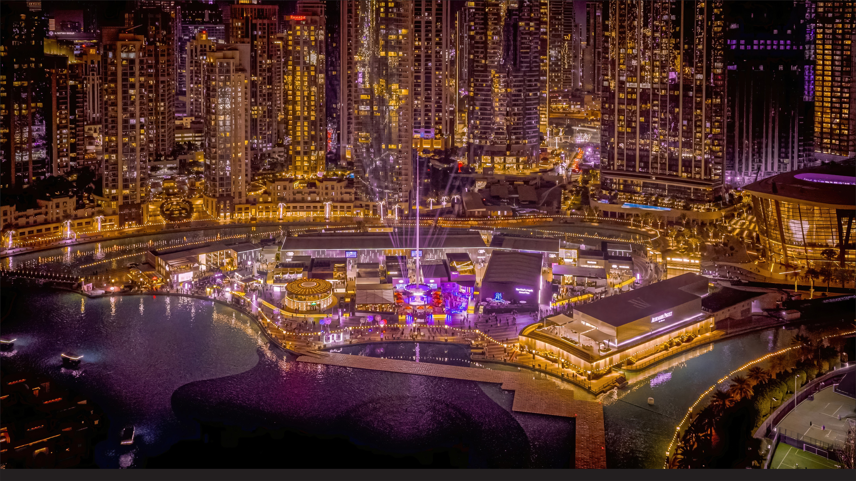 Dubai Watch Week 2025 — night aerial of Burj Park