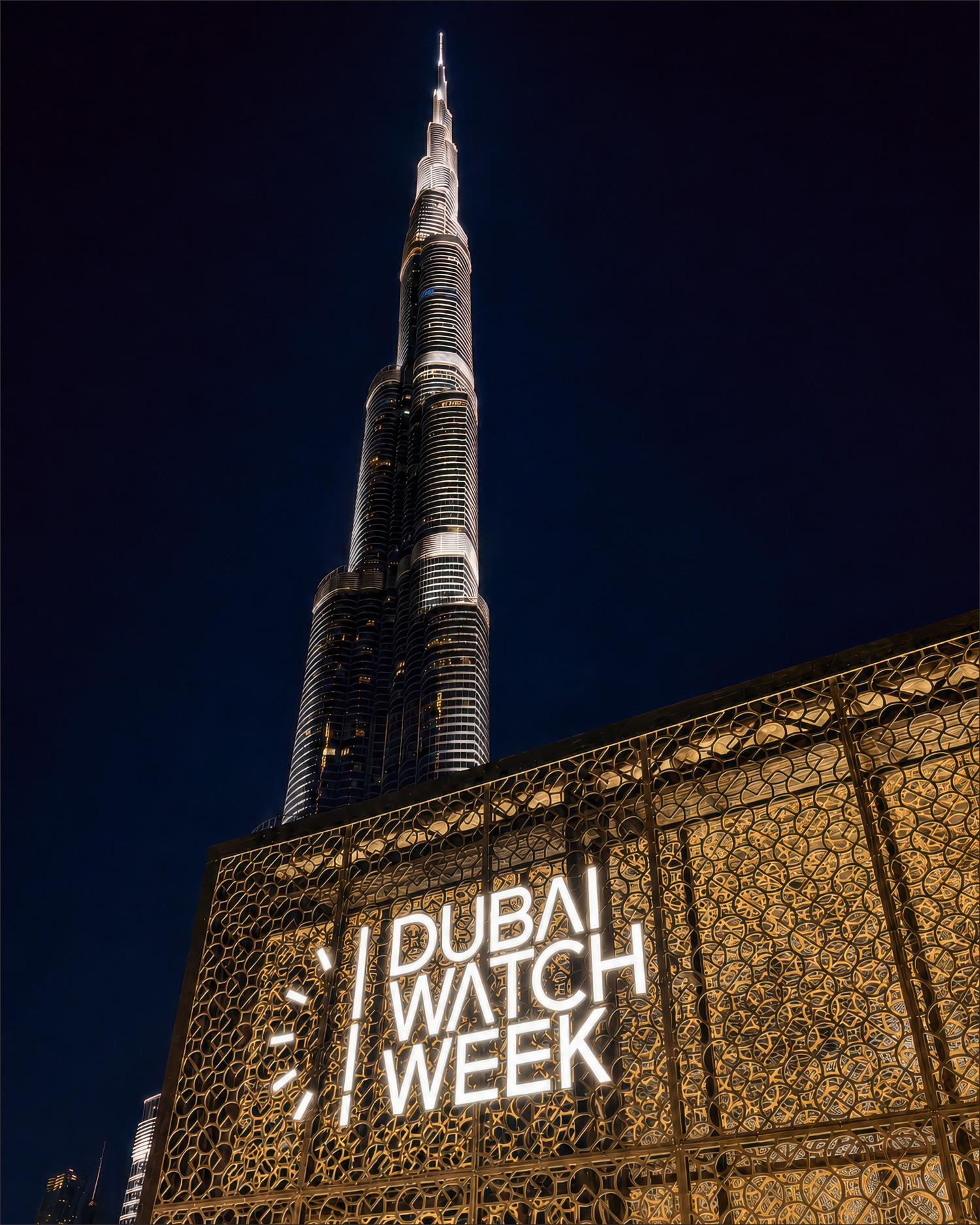 Dubai Watch Week 2025 — entrance and Burj Khalifa at night